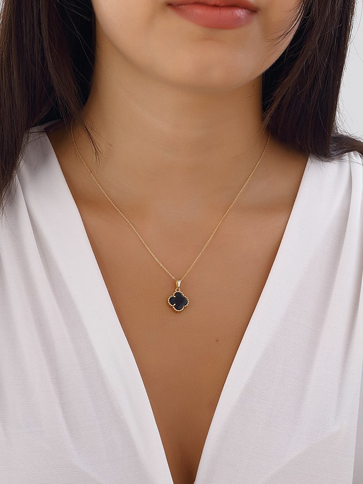 Vergulde ketting met parelmoersierelementen