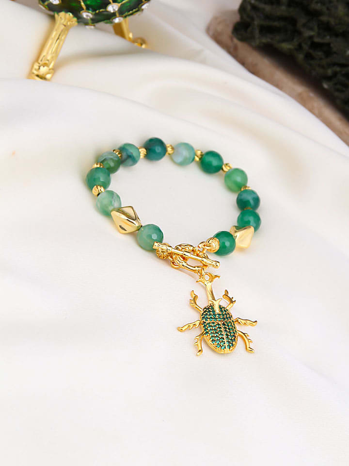 Vergulde armband met edelstenen en hanger