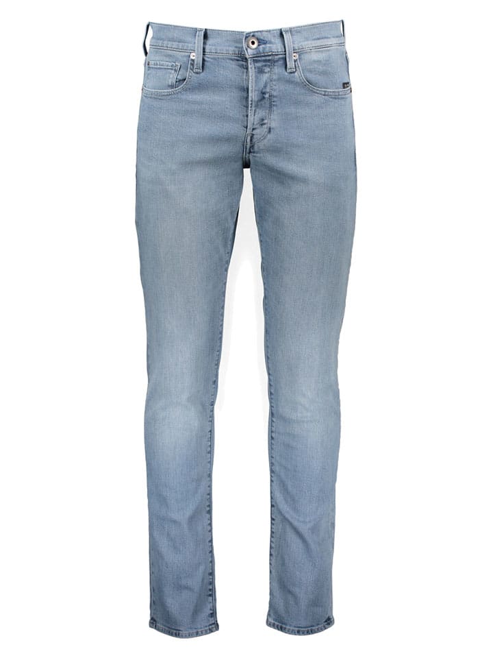 Dżinsy - Tapered fit - w kolorze błękitnym