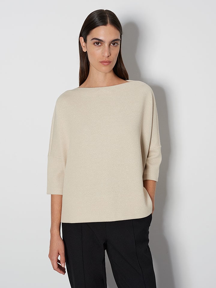 Sweter w kolorze beżowym