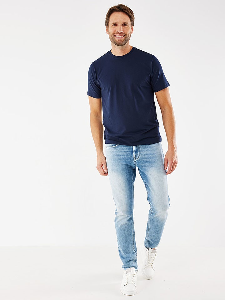 Dżinsy - Tapered fit - w kolorze błękitnym