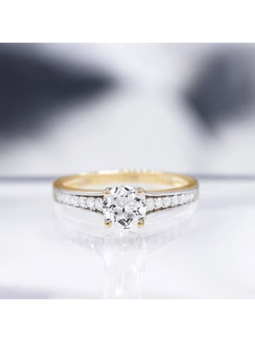 DIAMOND & CO Złoty pierścionek "Kriva" z diamentami i topazem