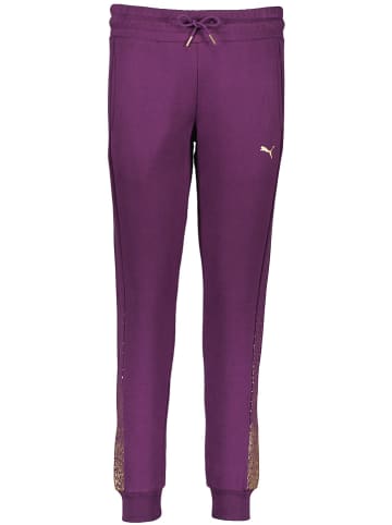 Puma Spodnie dresowe "Holiday" w kolorze fioletowym