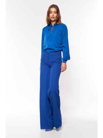Nife Spodnie w kolorze niebieskim