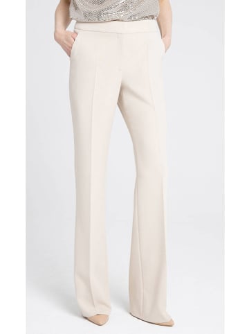 Deni Cler Spodnie w kolorze kremowym