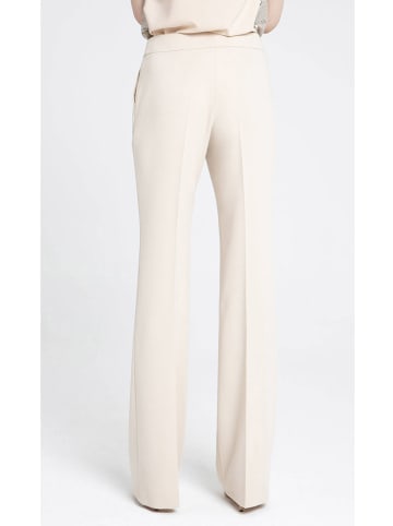 Deni Cler Spodnie w kolorze kremowym