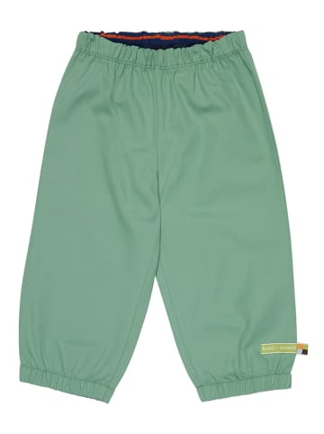 Loud + proud Spodnie przeciwdeszczowe w kolorze zielonym