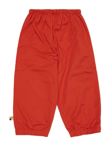 loud + proud Spodnie przeciwdeszczowe w kolorze pomarańczowym