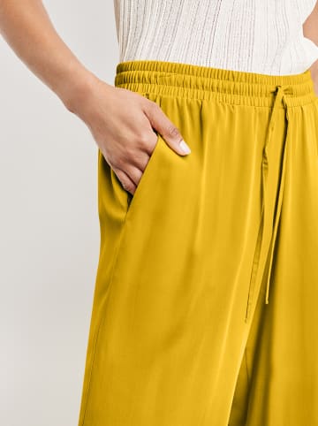 TAIFUN Spodnie w kolorze żółtym