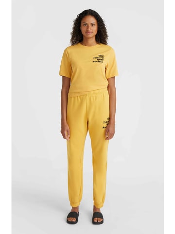 O´NEILL Spodnie dresowe "Future Surf Society" w kolorze żółtym