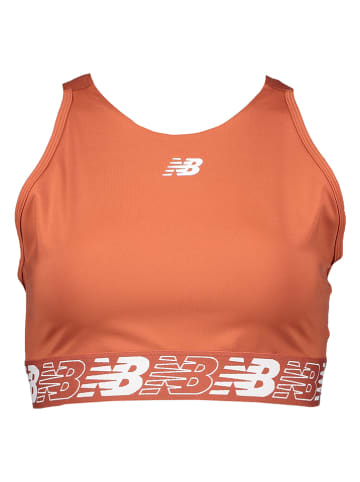 New Balance Biustonosz sportowy "Relentless" w kolorze pomarańczowym