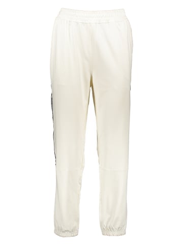 New Balance Spodnie dresowe "Relentless" w kolorze kremowym