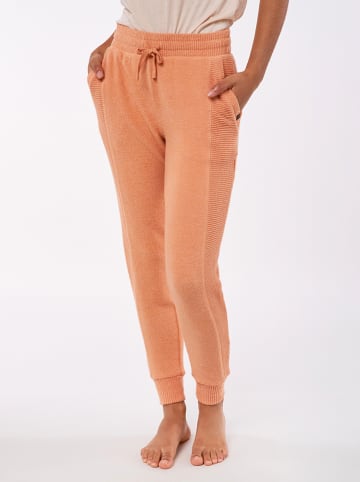 Rip Curl Spodnie dresowe "Cosy II" w kolorze pomarańczowym