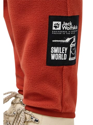 Jack Wolfskin Spodnie polarowe "Smileyworld" w kolorze pomarańczowym