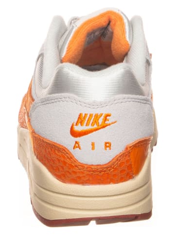 Nike Skórzane sneakersy "Air Max 1" w kolorze kremowo-pomarańczowym