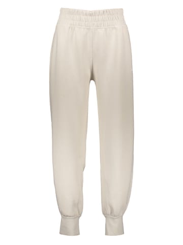 adidas Spodnie sportowe "STU" w kolorze beżowym