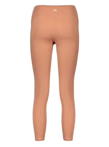 adidas Legginsy sportowe "YGA Lux Wind" w kolorze pomarańczowym