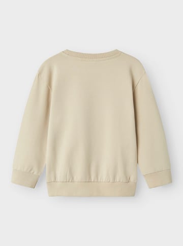 name it Bluza "Dennis" w kolorze beżowym ze wzorem
