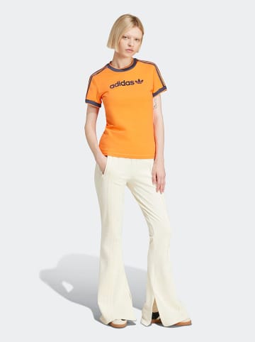 adidas Spodnie dresowe w kolorze kremowym