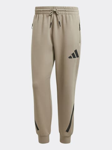 adidas Spodnie dresowe "M Z.N.E." w kolorze beżowym