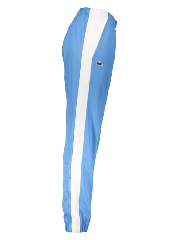 Lacoste Spodnie sportowe w kolorze błękitno-białym
