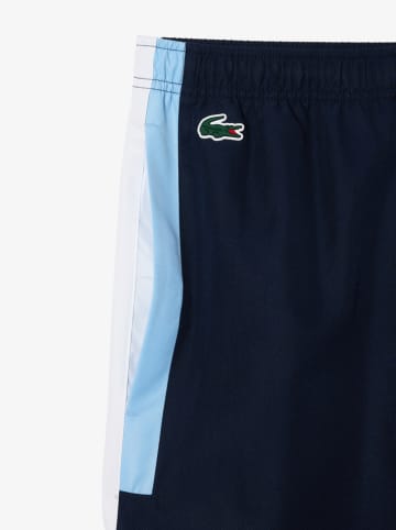 Lacoste Spodnie sportowe w kolorze granatowo-błękitno-białym