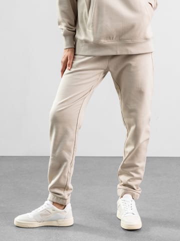 Les Lunes Spodnie dresowe "Frayaa" w kolorze beżowym