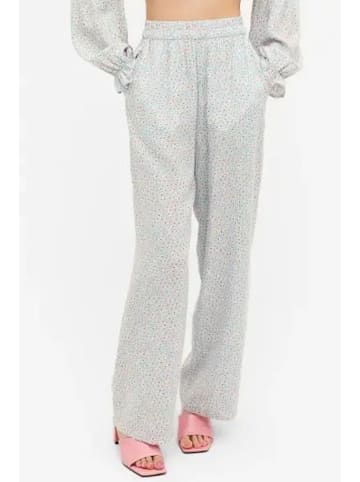 Monki Spodnie w kolorze turkusowo-białym