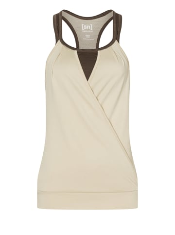 super.natural Top sportowy "Liquid Flow" w kolorze kremowym