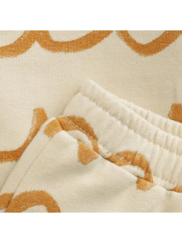 Noppies Spodnie dresowe "Tanton" w kolorze beżowym