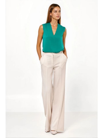 Nife Spodnie w kolorze beżowym