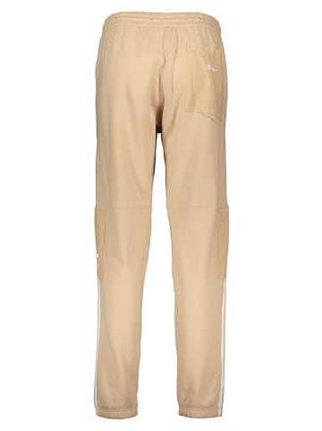 adidas Spodnie dresowe "Parley" w kolorze beżowym