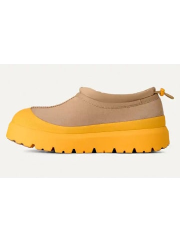 UGG Skórzane slippersy "Tasman Weather" w kolorze beżowo-żółtym