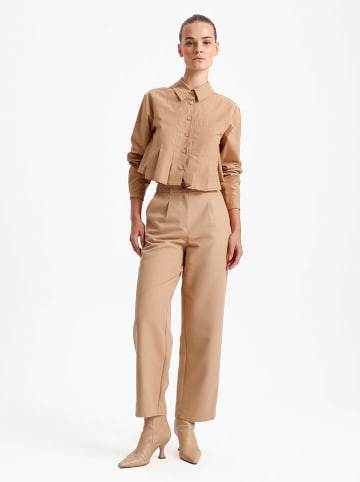 BGN Spodnie w kolorze beżowym