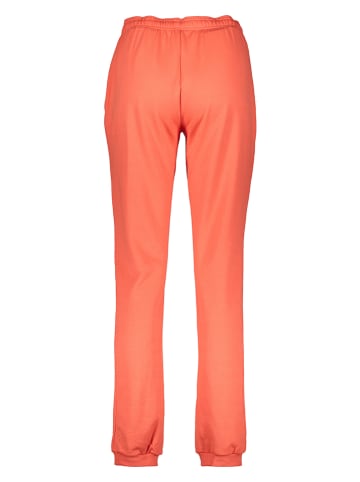 asics Spodnie dresowe "Sigma" w kolorze pomarańczowym