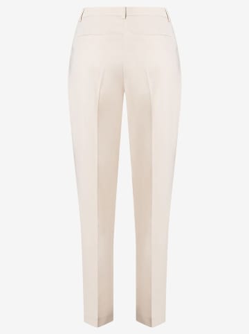 More & More Spodnie w kolorze kremowym