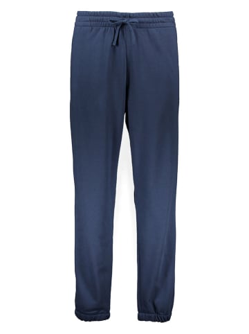 New Balance Spodnie dresowe "Uni-ssentials French Terry" w kolorze granatowym