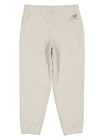 New Balance Spodnie dresowe "Essentials" w kolorze beżowym