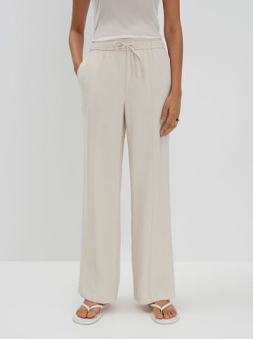Someday Spodnie "Cevil" w kolorze kremowym