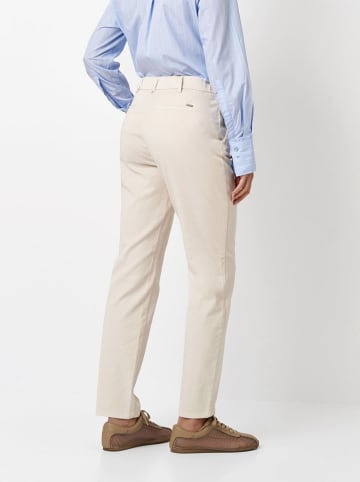 Toni Spodnie chino w kolorze kremowym