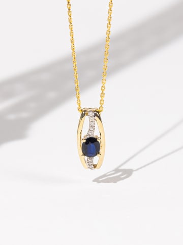 DIAMOND & CO Złota zawieszka "Dumai" z diamentami i szafirem