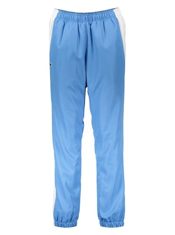 Lacoste Spodnie sportowe w kolorze błękitno-białym