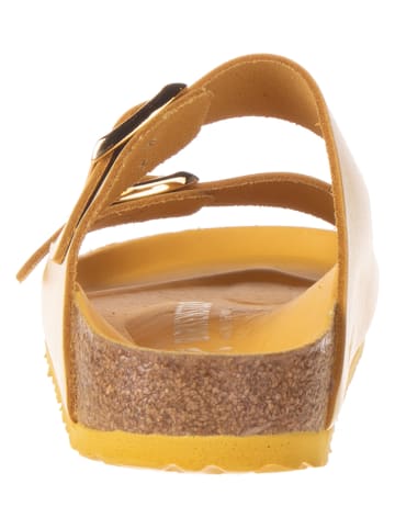 Birkenstock Skórzane klapki w kolorze żółtym