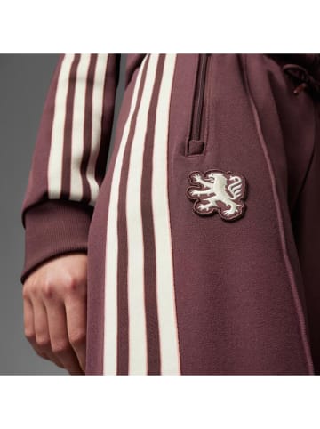 adidas Spodnie dresowe "Olympique Lyonnais Terrace Icons" w kolorze czerwonym