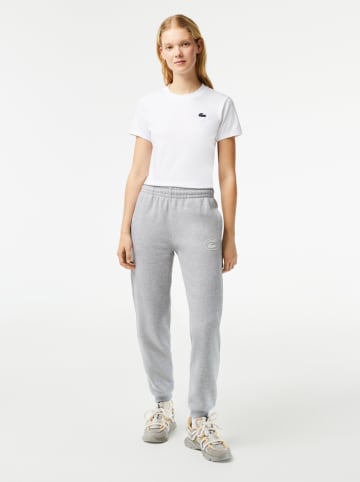 Lacoste Spodnie dresowe w kolorze szarym