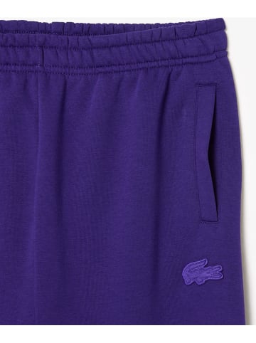Lacoste Spodnie dresowe w kolorze fioletowym