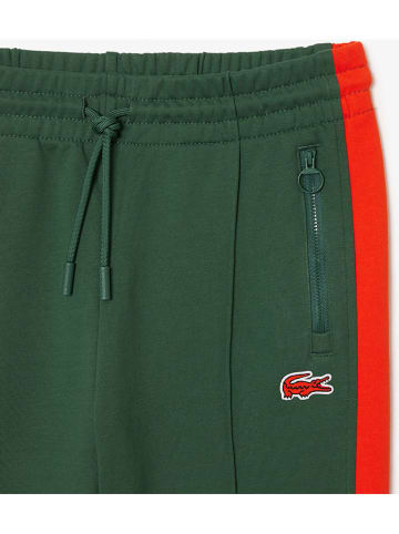 Lacoste Spodnie dresowe w kolorze ciemnozielonym