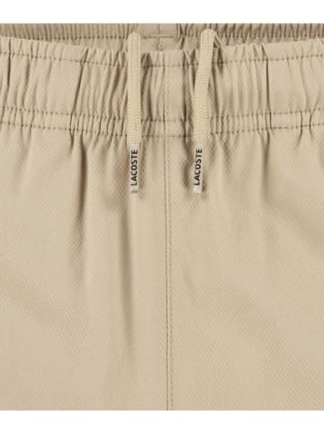Lacoste Kids Bojówki w kolorze beżowym