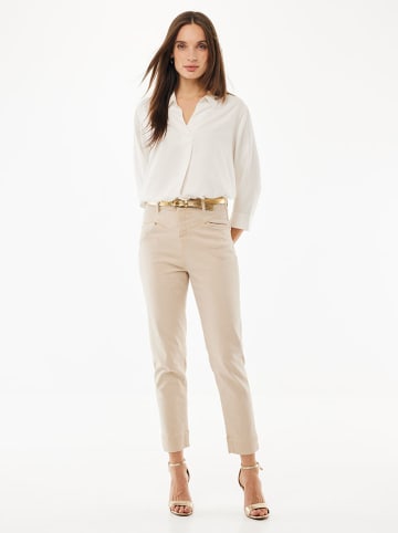 Mexx Dżinsy - Tapered fit - w kolorze beżowym