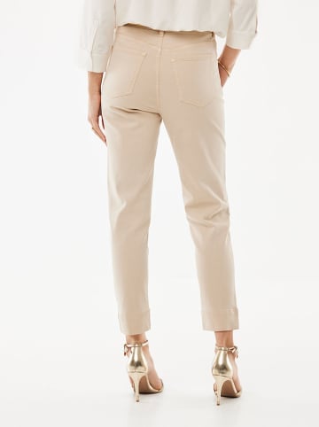 Mexx Dżinsy - Tapered fit - w kolorze beżowym